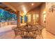 Cozy covered patio with outdoor seating, perfect for relaxing or al fresco dining at 19275 N 88Th Way, Scottsdale, AZ 85255