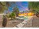 Beautiful backyard oasis featuring a large pool and mature landscaping at 19275 N 88Th Way, Scottsdale, AZ 85255
