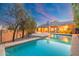 Sparkling pool with well-maintained landscaping against the home's exterior at 19275 N 88Th Way, Scottsdale, AZ 85255