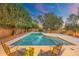 Large pool with lush landscaping and seating, perfect for summer days at 19275 N 88Th Way, Scottsdale, AZ 85255