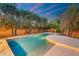 Backyard pool featuring underwater lighting with a smooth entry and lush landscaping at 19275 N 88Th Way, Scottsdale, AZ 85255