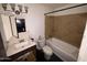 Bathroom with tub, toilet, and vanity sink at 2007 W Roeser Rd, Phoenix, AZ 85041
