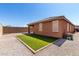 The backyard has a covered patio and a small patch of artificial grass at 2391 S 171St Ln, Goodyear, AZ 85338