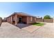 The property boasts a covered patio, rock landscaping and artificial grass at 2391 S 171St Ln, Goodyear, AZ 85338