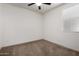 Neutral carpeted bedroom with ceiling fan, window and white walls at 2391 S 171St Ln, Goodyear, AZ 85338