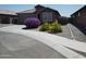 Charming single-story home featuring a well-maintained yard, landscaping and a two-car garage at 2391 S 171St Ln, Goodyear, AZ 85338