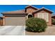 Charming single-story home featuring a well-maintained yard and a two-car garage at 2391 S 171St Ln, Goodyear, AZ 85338