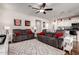 Bright and airy living room featuring a modern ceiling fan and an open floorplan at 2391 S 171St Ln, Goodyear, AZ 85338
