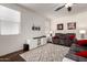 Spacious living room featuring a plush sofa, modern furniture, and plenty of natural light at 2391 S 171St Ln, Goodyear, AZ 85338