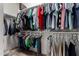 Walk-in closet with double-hang shelving providing storage for clothes at 2391 S 171St Ln, Goodyear, AZ 85338