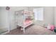 Cozy ' bedroom with bunk beds, neutral carpet, and playful decor at 2494 N Heritage St, Buckeye, AZ 85396