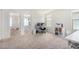 Bright bedroom with carpet, windows, and two workstations at 2494 N Heritage St, Buckeye, AZ 85396