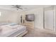 Bedroom featuring a bed, crib, and dresser with a TV, offering versatile living space at 2494 N Heritage St, Buckeye, AZ 85396