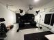 Converted garage studio with lighting, soundproofing, and comfortable seating for a professional recording setup at 2494 N Heritage St, Buckeye, AZ 85396