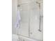 Clean, modern shower with glass doors and dual shower heads at 2494 N Heritage St, Buckeye, AZ 85396