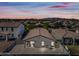 Aerial view of the property showcasing the backyard, surrounding neighborhood, and mountain views at 25657 W Beth Dr, Buckeye, AZ 85326