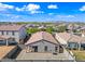 Aerial view of the home's backyard featuring a covered patio with seating, and a well-kept gravel area at 25657 W Beth Dr, Buckeye, AZ 85326