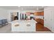 Modern kitchen with a center island, stainless steel appliances, and sleek wood cabinets at 25657 W Beth Dr, Buckeye, AZ 85326