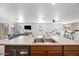 Kitchen island with double sink and open layout to the living room, perfect for entertaining at 25657 W Beth Dr, Buckeye, AZ 85326