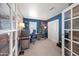 Inviting home office featuring modern design, natural wood accents, and ample workspace at 25657 W Beth Dr, Buckeye, AZ 85326