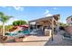 Spacious backyard with a pool, spa, pergola, outdoor kitchen and cozy fire pit, great for entertaining at 28021 N 23Rd Dr, Phoenix, AZ 85085