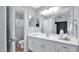 Bright bathroom features a white vanity, large mirror, and a separate toilet and shower area at 28021 N 23Rd Dr, Phoenix, AZ 85085