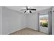 Minimalist bedroom with neutral tones and a window offering a view of the outdoors at 28021 N 23Rd Dr, Phoenix, AZ 85085
