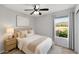 Serene bedroom features soft colors, cozy bedding, and a window overlooking a picturesque landscape at 28021 N 23Rd Dr, Phoenix, AZ 85085