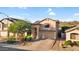 Inviting two story home showcasing a manicured front yard, driveway, and desert landscaping at 28021 N 23Rd Dr, Phoenix, AZ 85085
