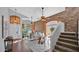 Spacious living area showcasing hardwood floors, a staircase, and seamless flow between rooms at 28021 N 23Rd Dr, Phoenix, AZ 85085