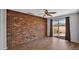 Charming office features a brick wall and a sliding glass door leading to a balcony at 28021 N 23Rd Dr, Phoenix, AZ 85085