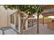 Enclosed patio featuring brick floors, a sunroom and outdoor kitchen, creating a comfortable and stylish outdoor living space at 28021 N 23Rd Dr, Phoenix, AZ 85085