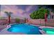 Backyard pool and spa with landscape, waterfall feature and brick wall, perfect for relaxation and outdoor entertainment at 28021 N 23Rd Dr, Phoenix, AZ 85085