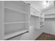 Spacious walk-in closet with ample shelving and hanging space for organized storage at 28021 N 23Rd Dr, Phoenix, AZ 85085