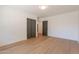 Clean bedroom, wood-look floors, neutral paint, view through open door, large closet at 3651 N 49Th Pl, Phoenix, AZ 85018
