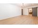 Large room with bright light, wood-look flooring, and view to en-suite bathroom at 3651 N 49Th Pl, Phoenix, AZ 85018