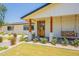 Inviting front porch with a swing and beautifully landscaped yard at 3651 N 49Th Pl, Phoenix, AZ 85018