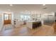 Spacious kitchen with a large island, stainless steel appliances, and modern lighting at 3651 N 49Th Pl, Phoenix, AZ 85018