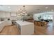 Open-concept kitchen and dining area with modern appliances and island seating at 3651 N 49Th Pl, Phoenix, AZ 85018