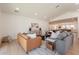 Open-concept living area featuring hardwood floors, recessed lighting, and modern furnishings at 3651 N 49Th Pl, Phoenix, AZ 85018