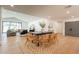 Open-concept dining and living areas with wood floors and comfortable seating at 3651 N 49Th Pl, Phoenix, AZ 85018