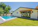 Inviting backyard pool with modern design, surrounded by a well-maintained lawn at 3651 N 49Th Pl, Phoenix, AZ 85018