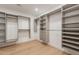 Expansive walk-in closet featuring built-in shelving, drawers, and ample storage space at 3651 N 49Th Pl, Phoenix, AZ 85018