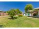 Lush backyard with mature trees, shed, and covered patio offering a relaxing outdoor space at 4140 E Glenrosa Ave, Phoenix, AZ 85018