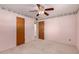 Bedroom view featuring wood doors and closet and floral wallpaper border at 4140 E Glenrosa Ave, Phoenix, AZ 85018
