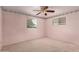 Bedroom features neutral carpet, floral wallpaper and ceiling fan with lighting at 4140 E Glenrosa Ave, Phoenix, AZ 85018