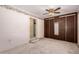 Comfortable bedroom with wall-to-wall closets and soft carpet flooring at 4140 E Glenrosa Ave, Phoenix, AZ 85018