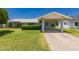 Quaint single-story home featuring an expansive lawn and a covered carport for easy access at 4140 E Glenrosa Ave, Phoenix, AZ 85018