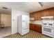 Well-equipped kitchen with a refrigerator, wooden cabinets and a clean, efficient design at 4140 E Glenrosa Ave, Phoenix, AZ 85018