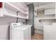 Laundry room featuring white appliances and shelving for ample storage at 4140 E Glenrosa Ave, Phoenix, AZ 85018